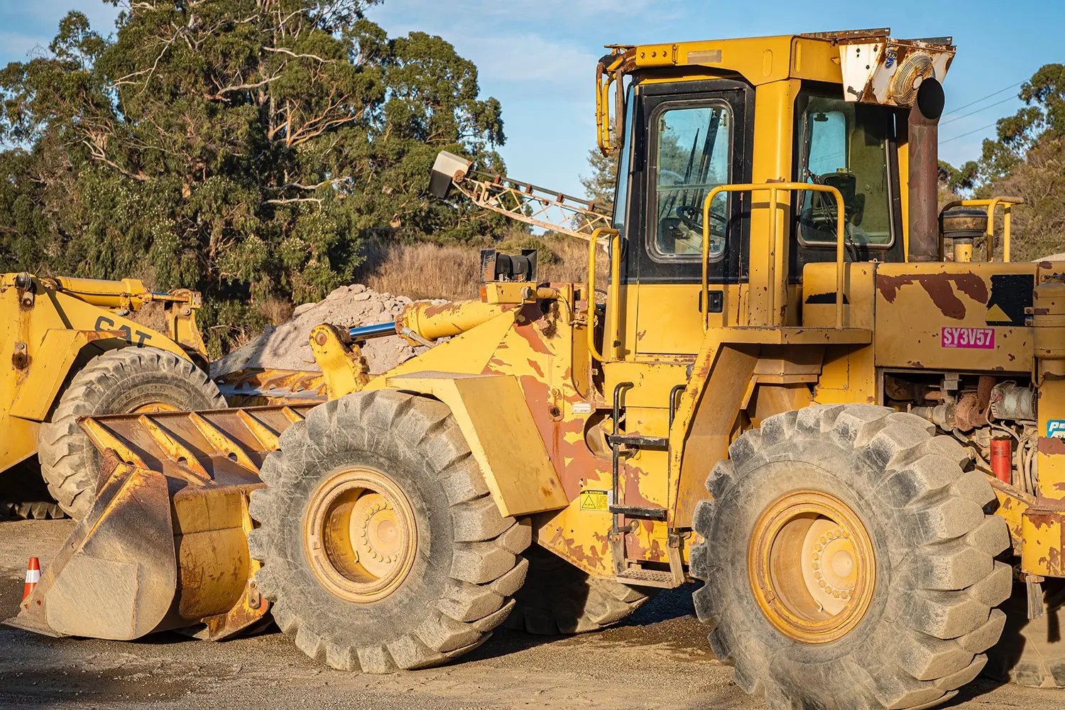 An sideways shot of a parked loader vehicle.